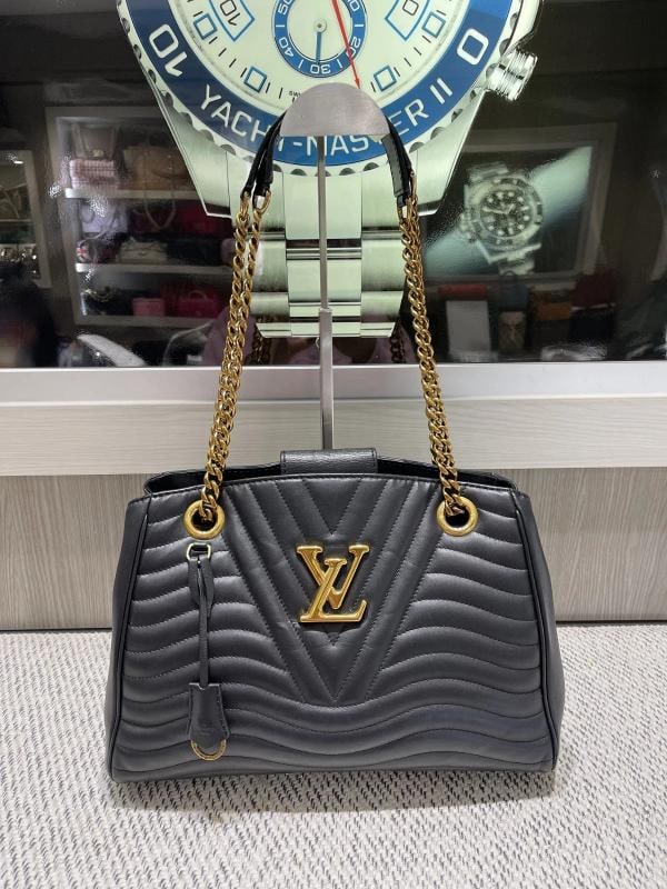 Louis Vuitton New Wave Chain Tote in Black Calfskin Leather: Condition: Pre-owned - Good,Bag Width: 12.75 in,Pattern: Chevron,Bag Height: 9.25 in,Closure: Magnetic,Lining Material: Microfiber,Hardware Color: Gold,Bag Depth: 6 in,Exterior Material: