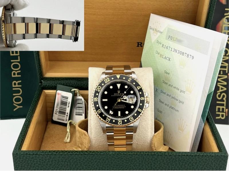 2005 Rolex GMT Master II 16713 40mm Black Dial 18k Yellow Gold Steel Box Papers: Style Number: 16713 Serial: F01**** Year: 2005 Model: Rolex GMT Master II Case Material: Stainless Steel Band: 18k Yellow Gold & Stainless Steel Bezel: Black Dial: Black Crystal: Sapphire Case Size: