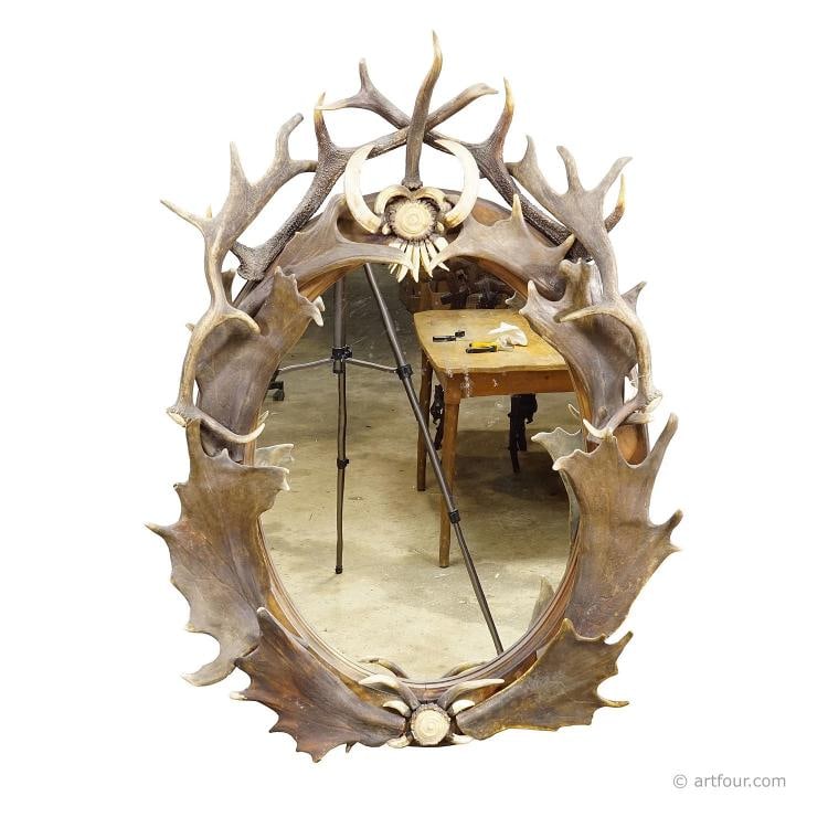 Antique Black Forest Mirror with Antler Arrangement ca. 1920s: Condition: Used,Original/Reproduction: original,Depth: 11.02,Width: 29.53,Country of Origin: Switzerland This striking wall mirror is framed with an elaborate arrangement of natural deer antlers,
