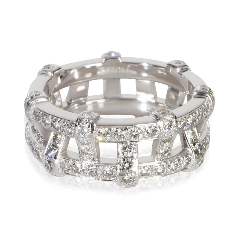 Tiffany & Co. Platinum Diamond Weave Ring: Condition: Pre-owned - Good,Shape: Round Brilliant,With Original Box/Packaging: Yes,With Papers: Yes,Side Stone Type: Diamond,Side Stone Weight (cts): 1.50,Metal Purity: 950,Report Type: Tiffany Certi