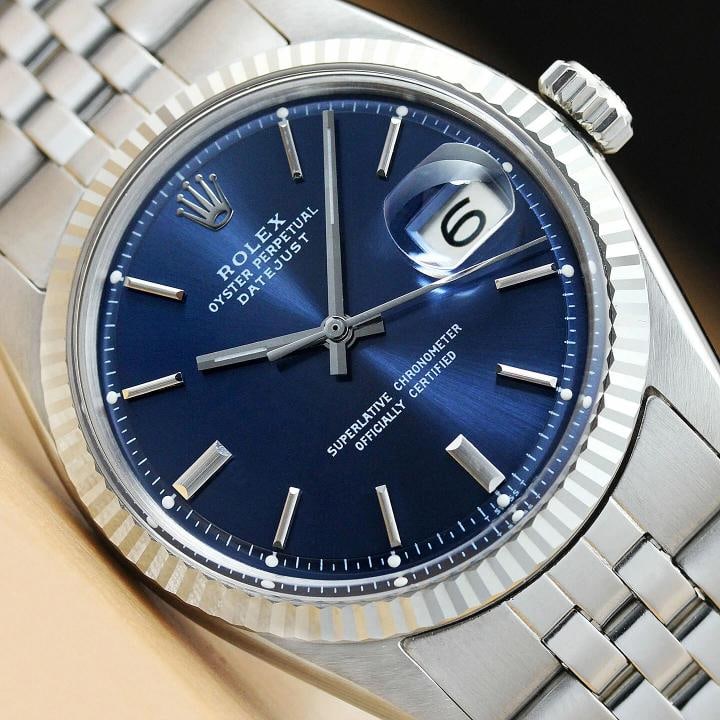 ROLEX MENS BLUE DIAL DATEJUST 1601 18K WHITE GOLD STAINLESS STEEL WATCH: This is an authentic Rolex Datejust 1601 watch with Rolex stainless steel folded jubilee bracelet, Rolex stick dial Ref., and Rolex 18K white gold fluted bezel. Descriptions: Brand: Rolex Model: Datej