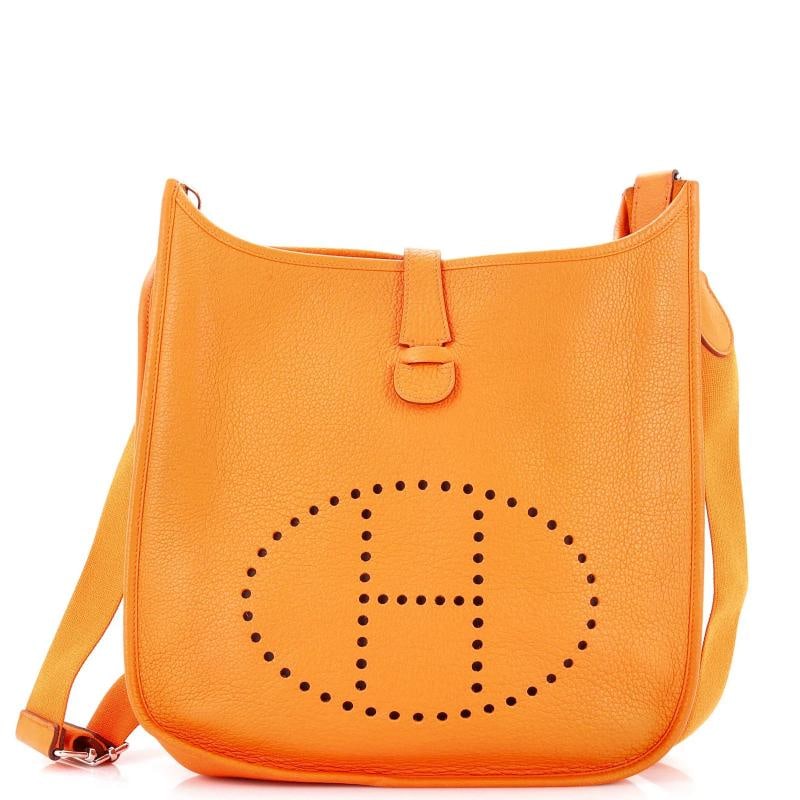 Hermes Evelyne Bag Gen III Clemence GM: Condition: Pre-owned - Fair,Brand: Hermes,Exterior Material: Leather,Style: Cross Body Bags,Exterior Color: Orange,Department: Women,Size: Gm,Accessories: With Strap Estimated Retail Price: $3,925