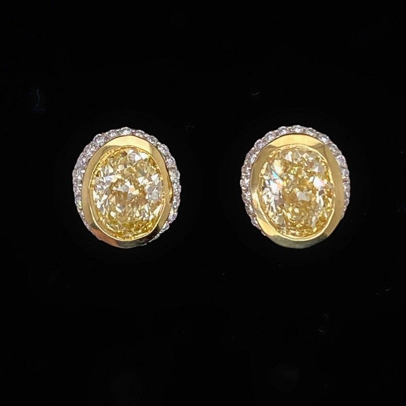Yellow Oval Diamond Earrings Bezel Set in 18kt Yellow Gold Plat: Condition: Pre-owned - Excellent,Number of Diamonds: 2,Main Stone Creation: Natural,Fancy Diamond Color: Yellow,Metal: Platinum,Secondary Stone: Diamond,Modified Item: No,Main Stone: Diamond,Brand: Un