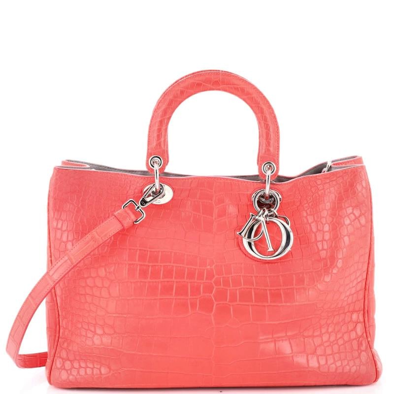 Christian Dior Diorissimo Tote Crocodile Large: Accessories: With Strap Measurements: Height 9", Width 15", Depth 5". Condition: Pre-owned - Good,Brand: Christian Dior,Exterior Material: Crocodile,Style: Totes,Exterior Color: Red,Department: