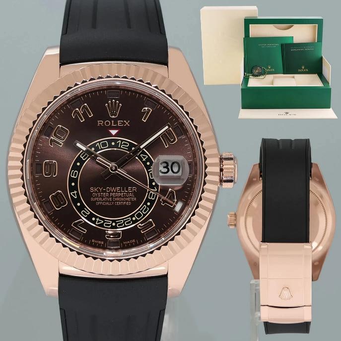 MINT ROLEX SKY DWELLER ROSE GOLD 326135 CHOCOLATE 42MM RUBBER WATCH BOX: Case & Dial Case Material: Rolex Rose Gold Case Size: 42mm Bezel: Rolex Rose Gold Fluted Crystal: Rolex Sapphire Dial: Rolex Chocolate Movement & Bracelet Movement: Rolex Automatic Bracelet Design: