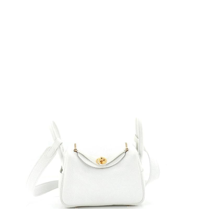 Hermes Lindy Bag Clemence Mini: Condition: Pre-owned - Good,Brand: Hermes,Exterior Material: Leather,Style: Cross Body Bags,Exterior Color: White,Department: Women,Size: Mini,Accessories: Dust Bag Condition: Very good. Exterior: min