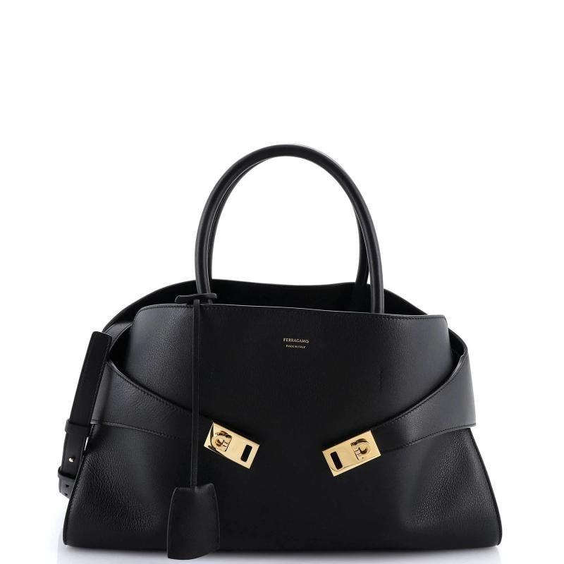 Salvatore Ferragamo Hug Top Handle Bag Leather Large: Accessories: Clochette, Dust Bag, With Strap Measurements: Height 9.5", Width 16", Depth 5". Condition: Pre-owned - Excellent,Brand: Salvatore Ferragamo,Exterior Material: Leather,Style: