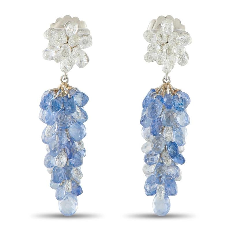 18K White Gold 5.0ct Diamond and Sapphire Dangle Earrings: Set in 18K White Gold, each earring measures 2.75 long by 0.44 wide.. Condition: Pre-owned - Good: This item has been gently used but is in good condition. It might have a few signs of wear, like