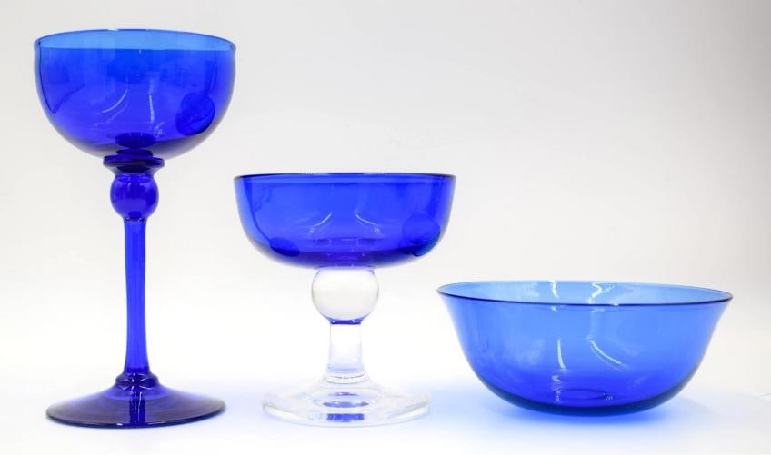 Steuben Flemish Blue Stemware Champagne Glass, Compote & Finger Bowl, Circa 1920: Measurements: Bowl 2" high by 4 7/8" diameter. Champagne 4" high by 3 3/4" wide. Wine 6 1/4" high by 3 3/8" wide..
