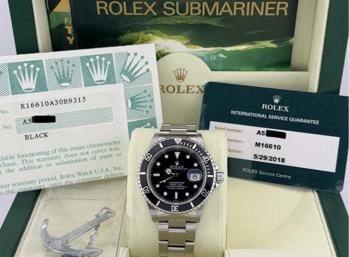 Rolex Submariner 16610 40mm Black Stainless Steel Service Receipt Box Papers: Style Number: 16610 Serial: A53**** Year: 1999 Model: Rolex Submariner Date Case Material: Stainless Steel Band: Stainless Steel Bezel: Black Dial: Black Crystal: Sapphire Case Size: 40mm Includes: - 