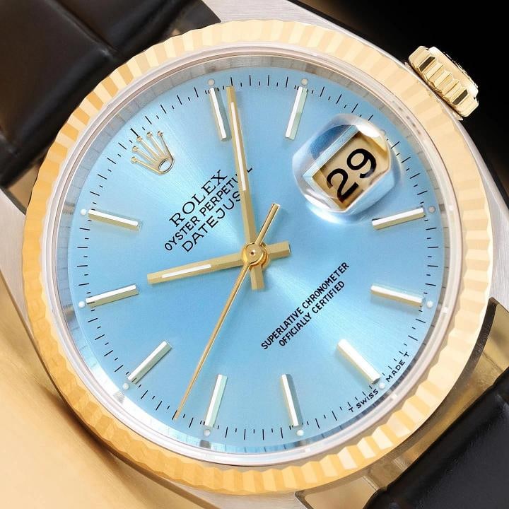 ROLEX MENS DATEJUST 16233 ICE BLUE 18K GOLD STEEL WATCH w/ BLACK LEATHER BAND: This is an authentic Rolex Datejust 16233 watch with Rolex stick dial Ref., Rolex 18K yellow gold fluted bezel, and custom genuine black leather strap..Descriptions: Brand: Rolex Model: Datejust