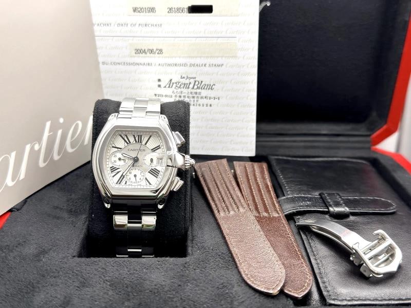 Cartier Roadster XL Chronograph W62019X6 2618 43mm Silver Dial Steel Box Paper: Condition: Pre-owned - Excellent,Bezel Color: Silver,Indices: Roman Numerals,Year Manufactured: 2000-2009,Band/Strap: Bracelet,Case Color: Silver,Department: Men,Watch Shape: Tonneau/Barrel,Style: