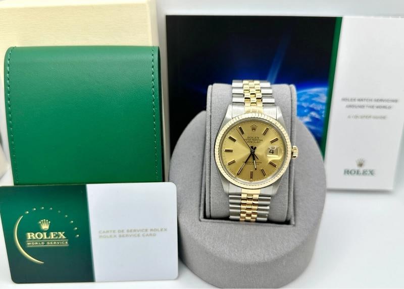 2024 Service Card Rolex Datejust 16013 36mm Champagne Dial 18K Yellow Gold Steel: Style Number: 16013 Serial: 7518*** Year: 1983 Model: Rolex Datejust Case Material: Stainless Steel Band: 18K Yellow Gold & Stainless Steel Bezel: 18K Yellow Gold Dial: Champagne Crystal: Acrylic