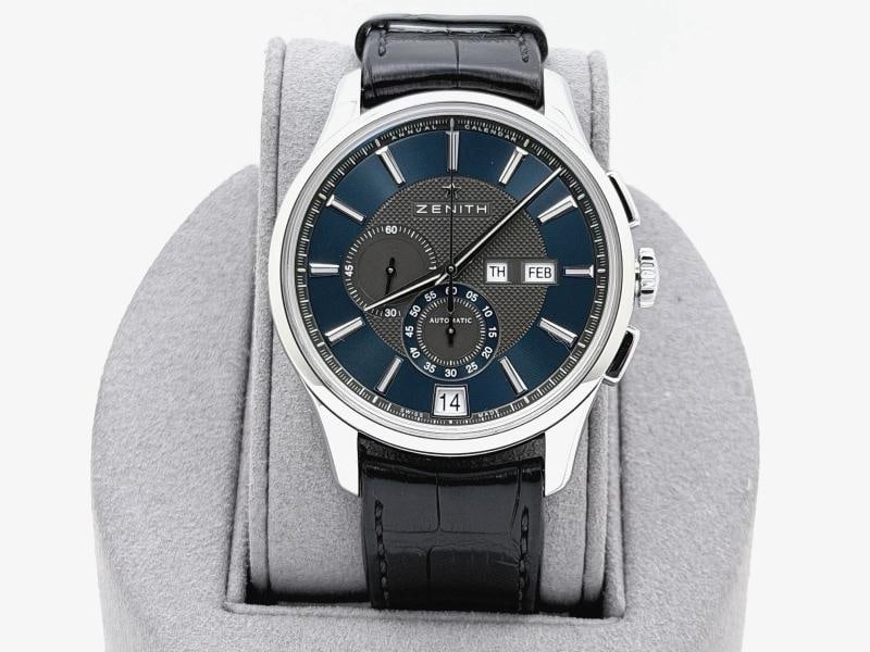 Zenith El Primero Winsor Annual Calendar 03.2070.4054 42mm Blue Dial Steel: Style Number: 03.2070.4054 Model: Zenith El Primero Winsor Annual Calendar Case Material: Stainless Steel Band: Black Leather Bezel: Stainless Steel Dial: Blue Crystal: Sapphire Case Size: 42mm