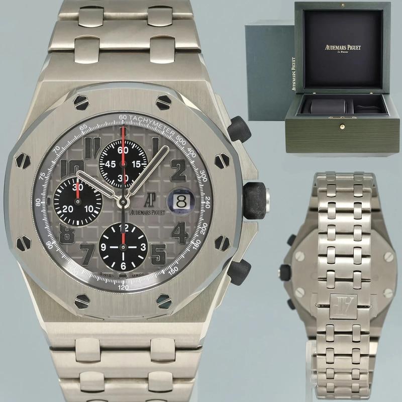 MINT Audemars Piguet Royal Oak Offshore Chrono Titanium 26170Ti Ghost Watch Box: Case & Dial Case Material: Audemars Piguet Titanium Case Size: 42mm Bezel: Audemars Piguet Titanium Crystal: Audemars Piguet Sapphire Dial: Audemars Piguet Grey "Ghost" Movement & Bracelet Movement: