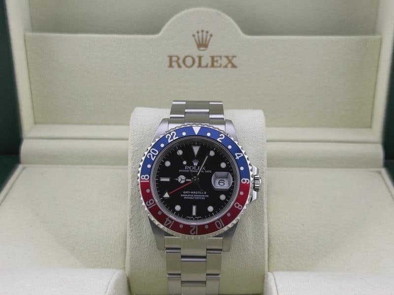 Rolex GMT Master II Pepsi 16710 40mm Red and Blue Bezel Stainless Steel: Style Number: 16710 Serial: P92**** Year: 2000 Model: Rolex GMT Master II Pepsi Case Material: Stainless Steel Band: Stainless Steel Bezel: Pepsi - Red & Blue Dial: Black Crystal: Sapphire Case Size: