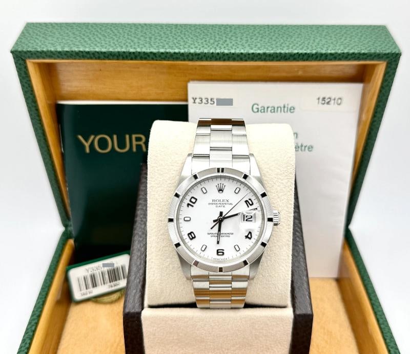 2004 Rolex Date 15210 34mm White Arabic Dial Engine Turned Bezel Steel Box Paper: Condition: Pre-owned - Excellent,Bezel Color: Silver,Year Manufactured: 2000-2009,Band/Strap: Rolex Oyster,Case Color: Silver,Department: Unisex Adults,Bezel Type: Engine-Turned,Watch Shape: