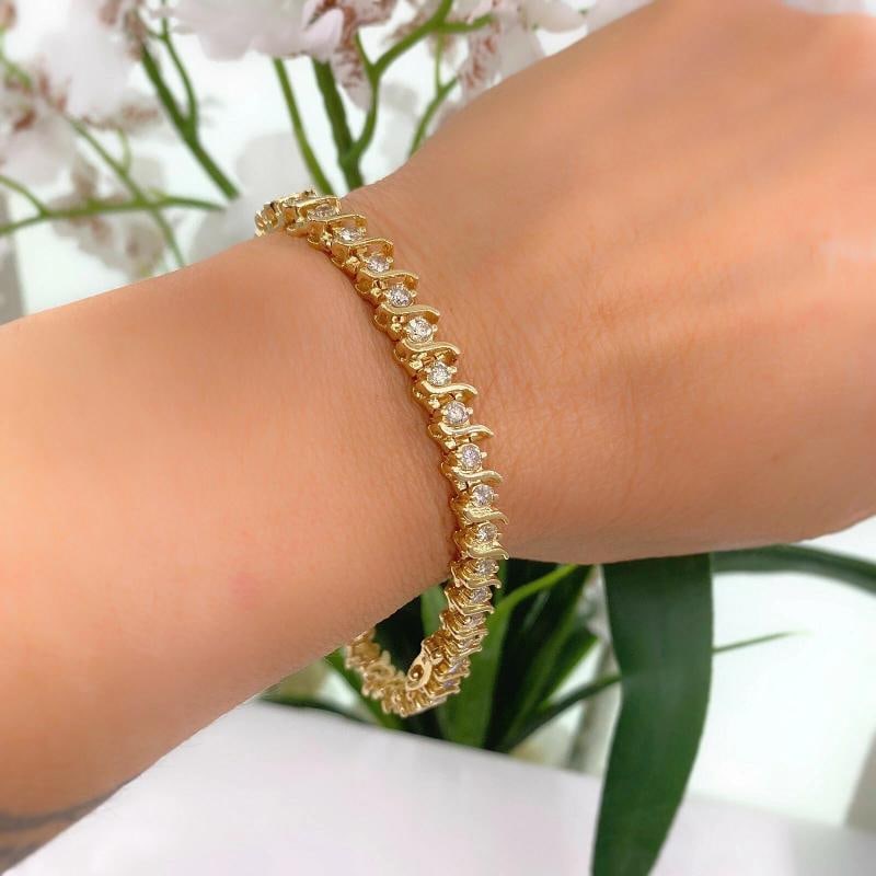 Diamond S Link Tennis Bracelet 14K Yellow Gold: Condition: Pre-owned - Excellent,Main Stone Creation: Natural,Fancy Diamond Color: Not Applicable,Length (inches): 7.25'',Metal: Yellow Gold,Total Carat Weight: 2.00 - 4.99,Modified Item: No,Main