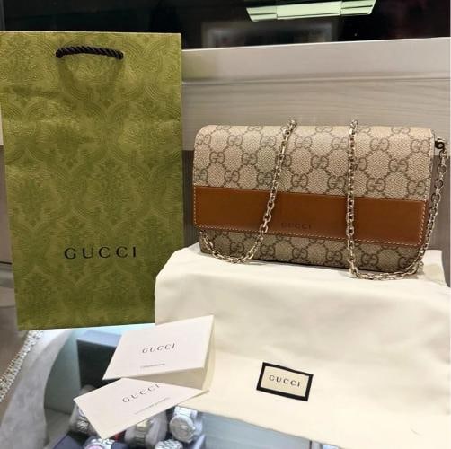 Gucci GG Emblem Wallet on Chain GG Supreme & Camel Brown Leather: Condition: Pre-owned - Excellent,Brand: Gucci,Department: Women,Exterior Color: Beige & dark brown GG Supreme interior,Style: Crossbody,Exterior Material: Brown smooth leather exterior,Country of