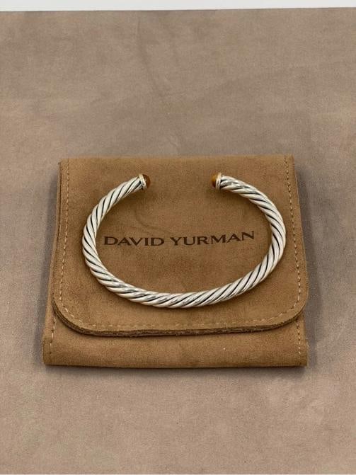 David Yurman Cable Cuff Bracelet 6mm Sterling Silver 14K Gold Tiger Eye L: A timeless David Yurman classic, this Cable Cuff Bracelet showcases the designer's iconic twisted helix motif that has defined the brand for over four decades. Crafted from sterling silver with 14K