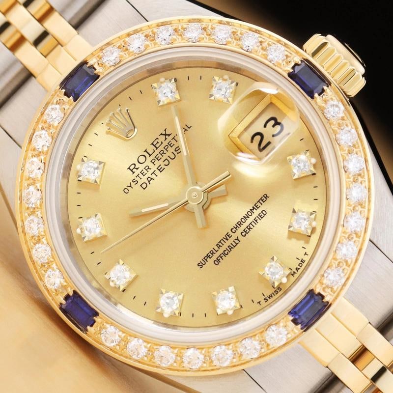 LADIES ROLEX DATEJUST 69173 CHAMPAGNE FACTORY DIAMOND 18K GOLD SAPPHIRE SS WATCH: This is an authentic Rolex Datejust 69173 watch with Rolex 18K yellow gold and stainless steel jubilee band, factory Rolex diamond dial Ref., and custom 18K yellow gold sapphire and diamond bezel.