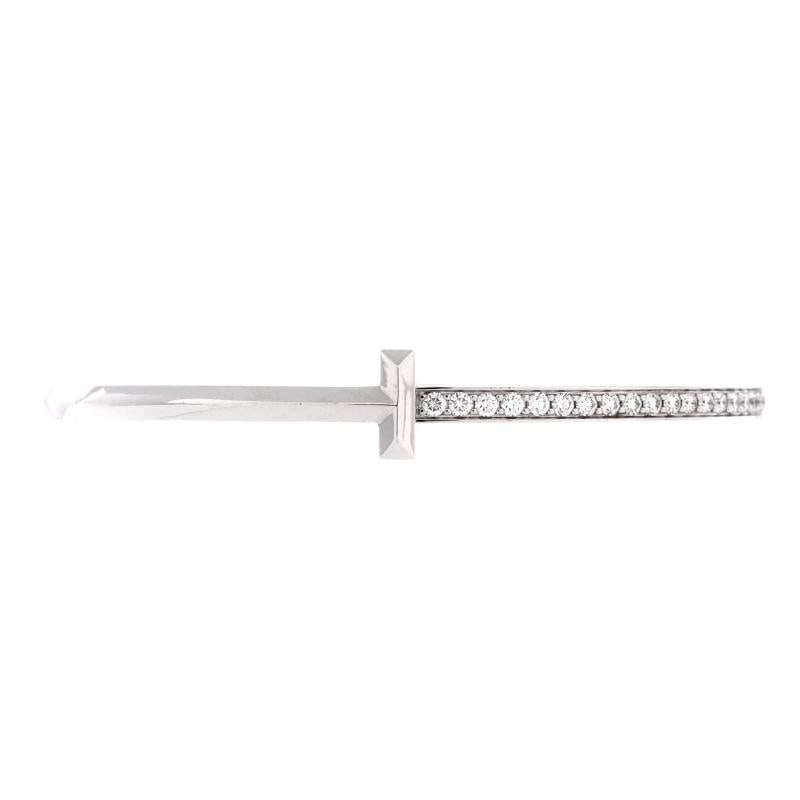 Tiffany & Co. T1 Hinged Bangle Bracelet 18K White Gold with Diamonds Narrow: Measurements: Circumference: 6.5 ", Width: 9 mm . Condition: Pre-owned - Good,Brand: Tiffany & Co.,Main Stone: Diamond,Metal: 18K White Gold,Metal Purity: 18K,Style: Bangle,Type: Bracelet,Color: