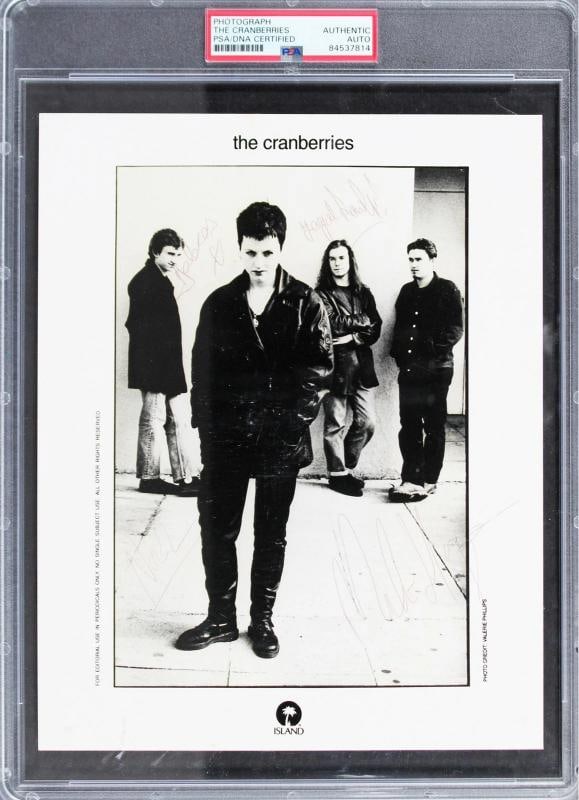 The Cranberries (4) O'Riordan, Lawler, Hogan & Hogan Signed 8x10 Photo PSA Slab: Original/Reprint: Original,Player: Dolores O'Riordan, Fergal Lawler, Mike Hogan & Noel Hogan,Autograph Authentication: PSA,Team: The Cranberries,PRODUCT_COA: PSA,PRODUCT_SIGNED_BY_NAME: Dolores