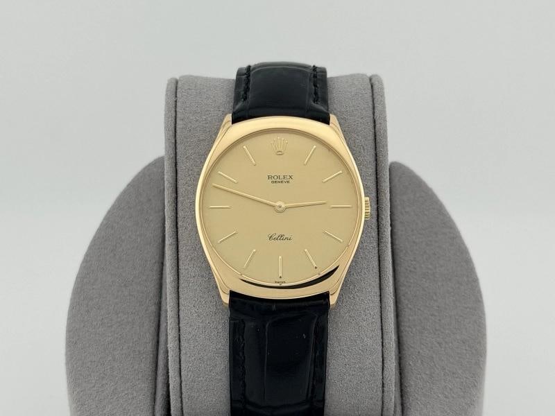Rolex Cellini 4133 31mm Champagne Dial 18k Yellow Gold: Style Number: 4133 Serial: L77**** Year: 1989 Model: Rolex Cellini Case Material: 18k Yellow Gold Band: Custom Black Leather Strap Bezel: 18k Yellow Gold Dial: Champagne. dial has some wear Crystal: