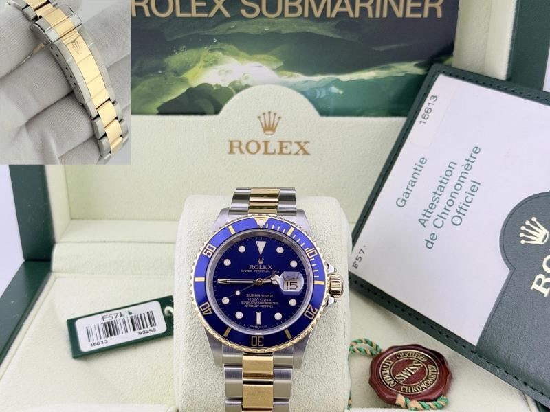 2005 Rolex Submariner Date Blue 16613 40mm Blue Dial 18k Gold Steel Box Paper: Style Number: 16613 Serial: F57**** Year: 2005 Model: Rolex Submariner Date Case Material: Stainless Steel Band: 18k Yellow Gold & Stainless Steel - Gold Through Buckle Bezel: Blue Dial: Blue