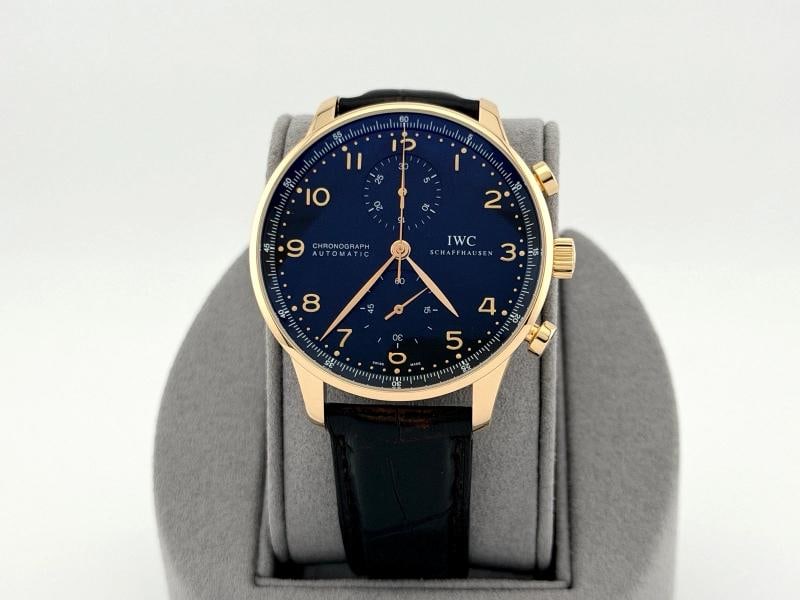 IWC Portuguese Chronograph Portugieser IW371415 41mm 18k Rose Gold Black Dial: Style Number: IW371415 Model: IWC Portugieser Portuguese Chronograph Case Material: 18k Rose Gold Band: Black Leather Bezel: 18k Rose Gold Dial: Black Crystal: Sapphire Case Size: 41mm Includes: