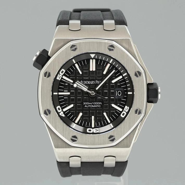 MINT Audemars Piguet Royal Oak Offshore Black Chrono Rubber 42mm 15703ST Watch: Watch Details Brand: Audemars Piguet Model: Royal Oak Offshore Reference: 15703ST Serial: H Condition: Mint In-Stock - SKU: H9867 Paperwork & Accessories Box: No, this item does not come with the