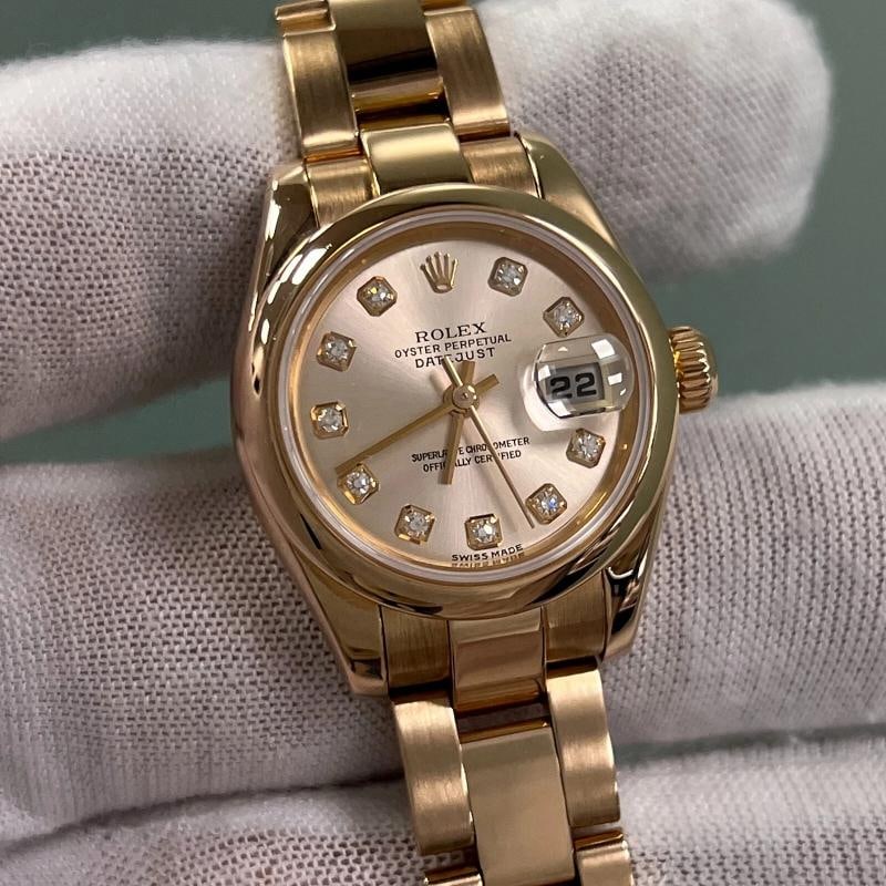 Rolex Ladies Datejust 179165 Factory Pink Diamond Dial 18K Rose Gold: Style Number: 179165 Serial: Y356*** Year: 2002 Model: Rolex Ladies Datejust Case Material: 18K Rose Gold Band: 18K Rose Gold Bezel: 18K Rose Gold Dial: Factory Rolex Pink / Rose Diamond Dial Face: Sa