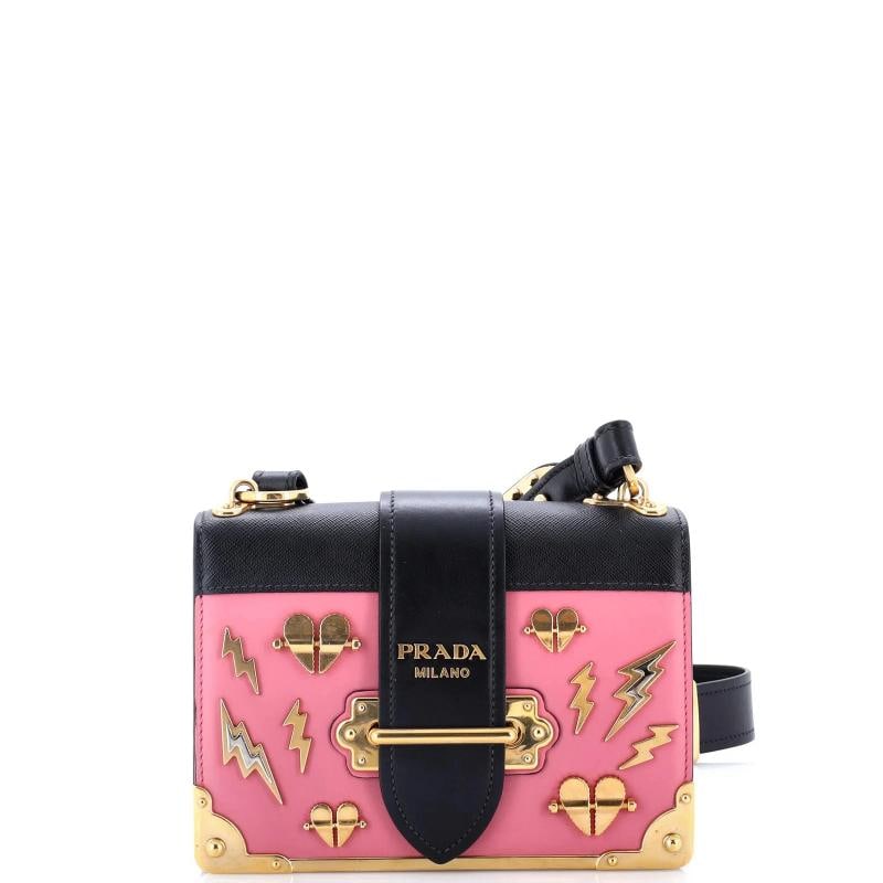 Prada Cahier Crossbody Bag Embellished Leather Small: Accessories: With Strap Measurements: Height 5", Width 8", Depth 3", Strap Drop 17.5-21.5"Condition: Pre-owned - Good,Brand: Prada,Exterior Material: Leather,Style: Cross Body Bags,Exterior Color: