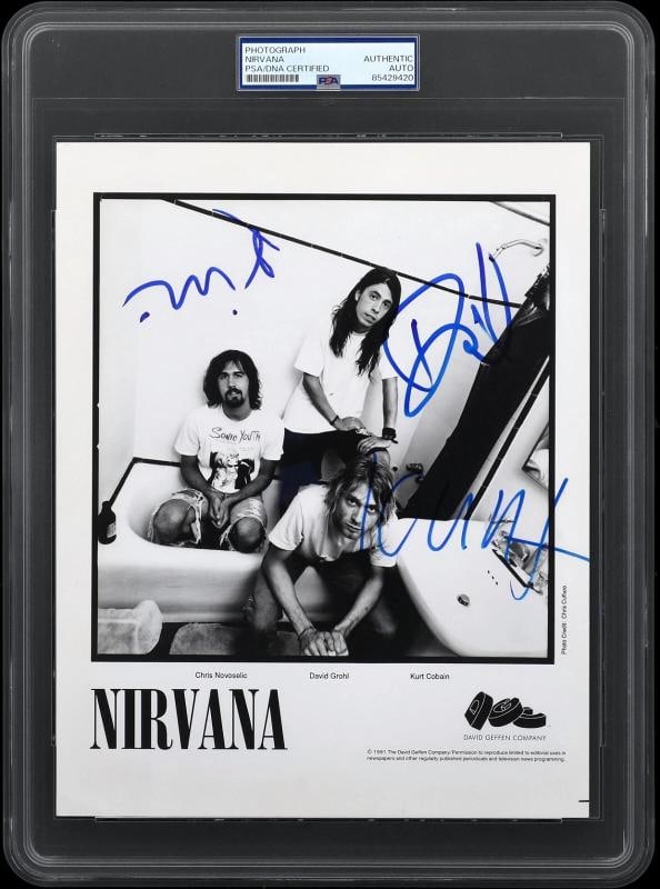 NIRVANA: Kurt Cobain, Dave Grohl and Krist Novoseli Signed Promo Photo (PSA + Beckett LOA)