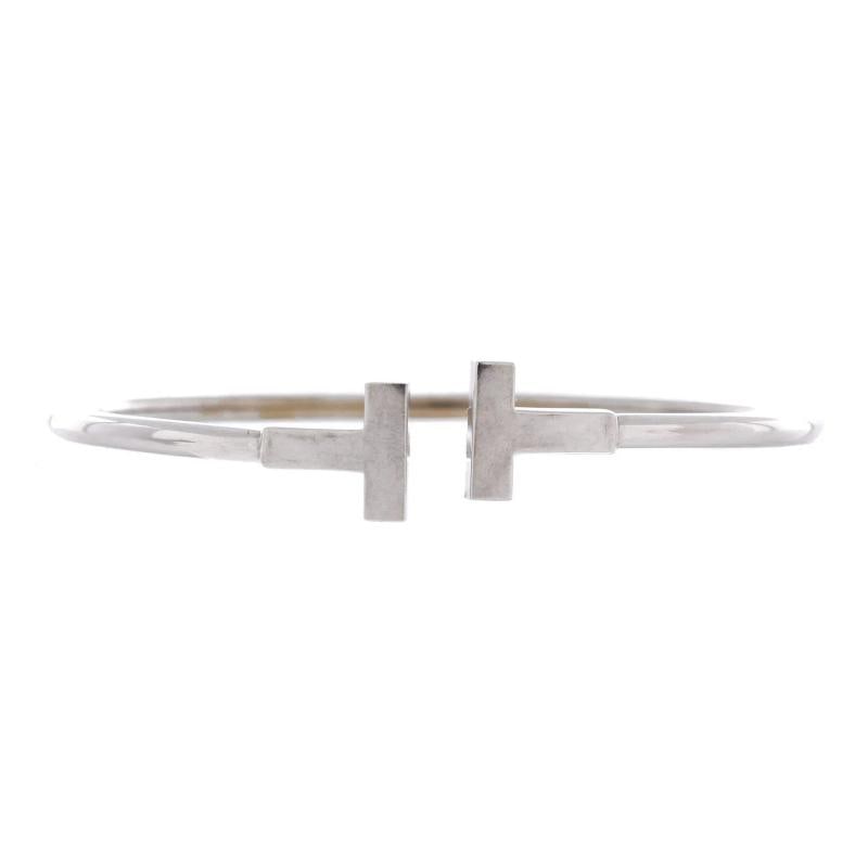 Tiffany & Co. T Wire Bracelet 18K White Gold: Measurements: Circumference: 6.40 ", Width: 2.30 mm . Condition: Pre-owned - Good,Brand: Tiffany & Co.,Main Stone: Unknown,Metal: 18K White Gold,Metal Purity: 18K,Style: Bracelet,Type: