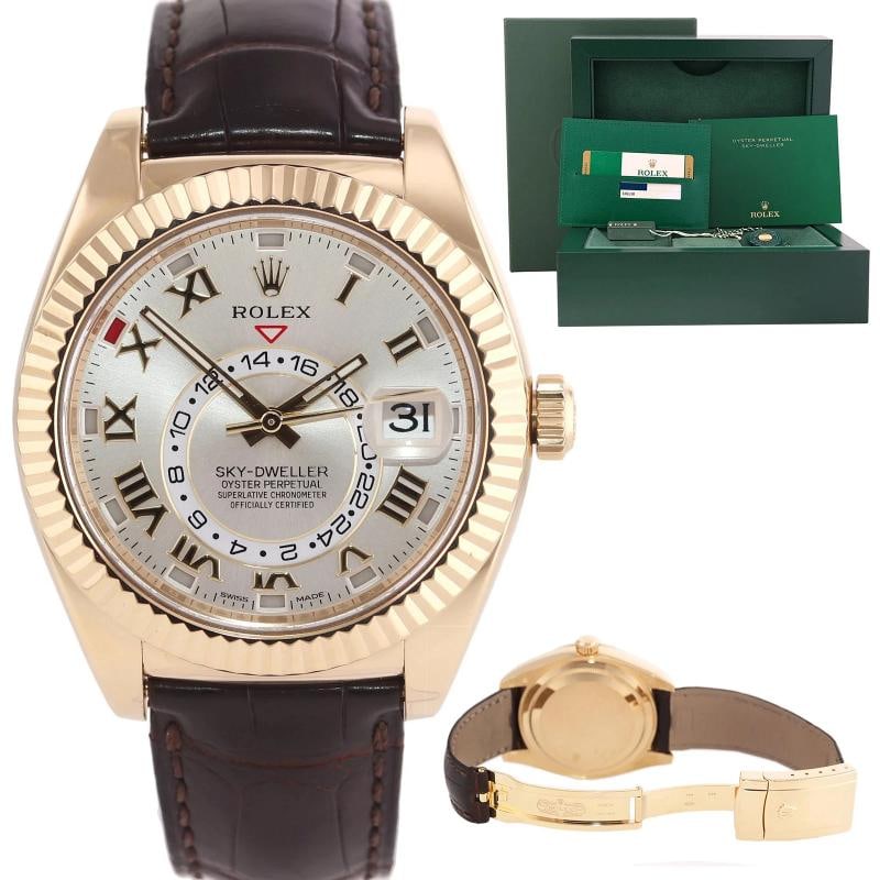 PAPERS MINT 2016 Rolex Sky-Dweller Yellow Gold 326138 42mm Silver Leather Watch: Case & Dial Case Material: Rolex Yellow Gold Case Size: 42mm Bezel: Rolex Yellow Gold Fluted Crystal: Rolex Sapphire Dial: Rolex Silver Roman with Date and Annual Calendar Functions Movement &