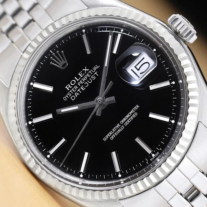 ROLEX MENS DATEJUST 18K WHITE GOLD BEZEL STAINLESS STEEL BLACK DIAL 36MM WATCH: This is an authentic Rolex Datejust 1601 watch with black stick dial Ref., Rolex 18K white gold fluted bezel, and Rolex stainless steel folded jubilee bracelet. Descriptions: Brand: Rolex Model:
