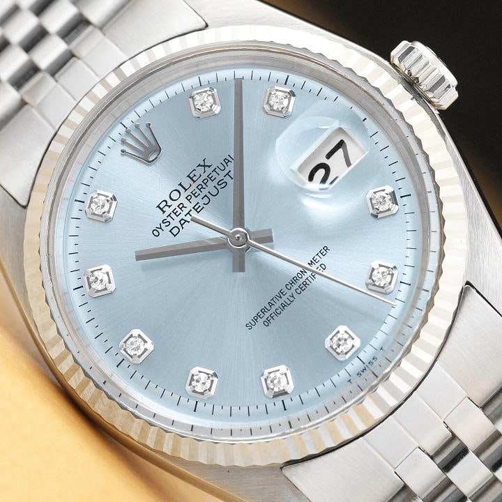 MENS ROLEX DATEJUST 1601 ICE BLUE DIAMOND 18K WHITE GOLD STAINLESS STEEL WATCH: This is an authentic Rolex Datejust 1601 watch with Rolex 18K white gold fluted bezel, Rolex dial Ref. with added diamond hour markers, and custom stainless steel jubilee bracelet. Descriptions: