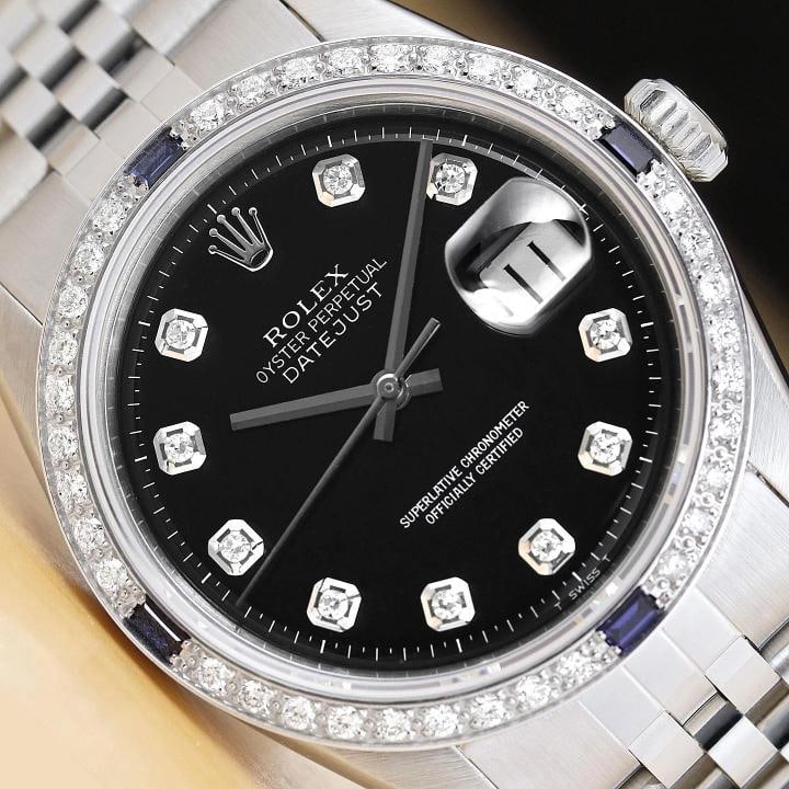ROLEX MENS DATEJUST 1603 18K WHITE GOLD DIAMOND SAPPHIRE STEEL BLACK WATCH: This is an authentic Rolex Datejust 1603 watch with Rolex dial Ref. with added genuine diamond markers, custom 18K white gold diamond and sapphire bezel, and custom stainless steel jubilee bracelet.