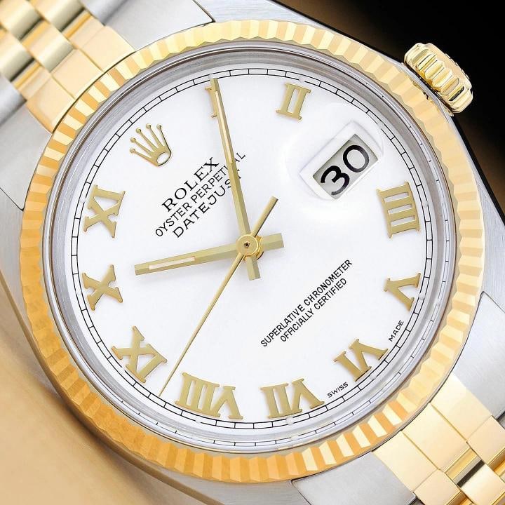 ROLEX MENS DATEJUST 16013 WHITE ROMAN DIAL 18K YELLOW GOLD STEEL TWO TONE WATCH: Condition: Pre-owned - Excellent,Bezel Color: Gold,Max Wrist Size: 7.26-7.5 in,Number of Jewels: 27 Jewels,Indices: Roman Numerals, 12-Hour Dial,Bezel: Rolex 18K Yellow Gold Fluted Bezel,Band/Strap: