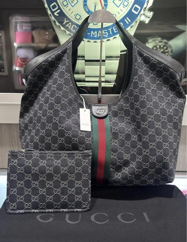 Gucci Giglio Large Tote Bag Black GG Denim Unworn: Condition: New with tags: This item is brand new and has never been used. It still has the original tags and/or ... Read moreabout the conditionNew with tags: This item is brand new and has never