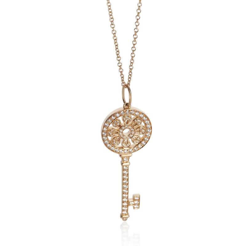 Tiffany & Co. Rose Gold Diamond Medium Model Petals Key Pendant: Condition: Pre-owned,Pendant Shape: Round Brilliant,Necklace Length: 20 in,Country of Origin: US,Clasp/Buckle Type: Spring Ring,Side Stone Type: Diamond,Side Stone Weight (cts): 0.30,Metal Purity: