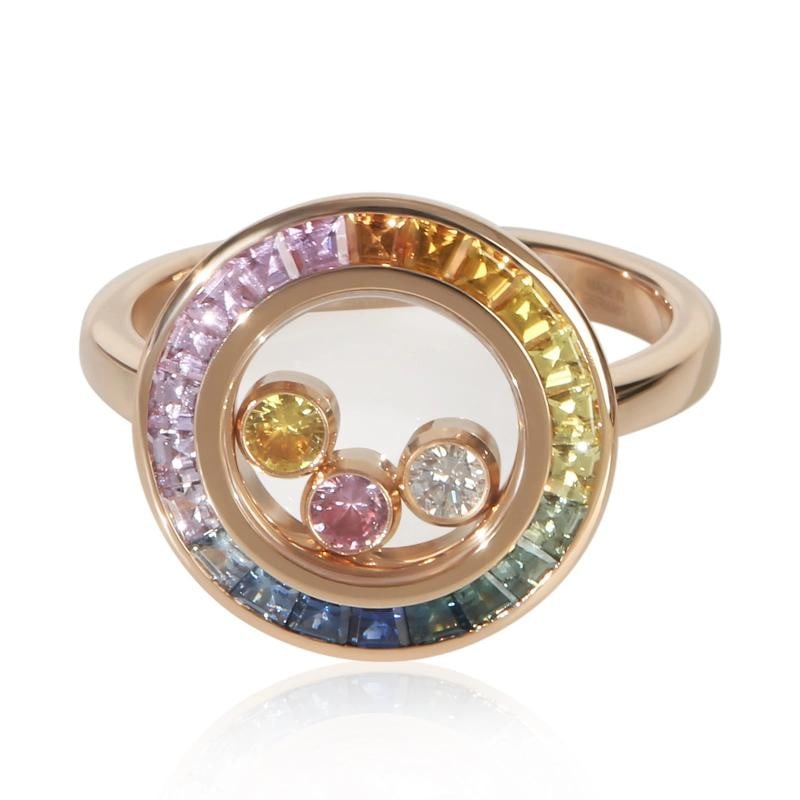 Chopard Rose Gold Sapphire and Diamond Happy Diamond Ring: Condition: Pre-owned,Shape: Round Brilliant,With Original Box/Packaging: Yes,With Papers: Yes,Main Stone Weight (cts): 0.90,Side Stone Type: Diamond,Side Stone Weight (cts): 0.10,Main Stone: Sapphire,