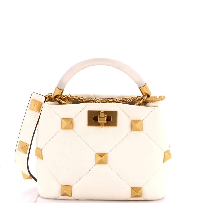 Valentino Garavani Roman Stud Top Handle Bag Quilted Leather Small: Handle Drop: 20" Measurements: 15" L x 5.5" W x 11.5" H Condition: Pre-owned - Excellent,Brand: Valentino Garavani,Exterior Material: Leather,Style: Top Handle,Exterior Color: White,Department: