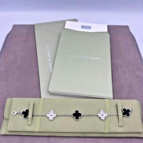 Van Cleef & Arpels Vintage Alhambra 5 Motif Black Onyx Diamond Bracelet: Dimensions: Inside Circumference: 7" Motif Length: 0.5" Motif Width: 0.75" Total Weight: 12.9 grams Includes: Van Cleef & Arpels travel pouch Booklet. Condition: Pre-owned - Excellent,Brand: Van