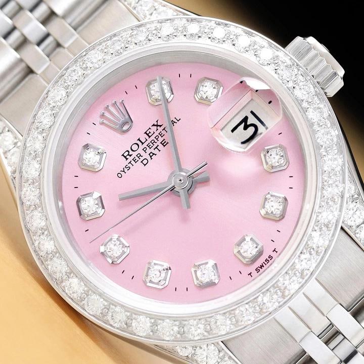 ROLEX LADIES DATE 6924 PINK DIAMOND 18K WHITE GOLD STAINLESS STEEL WATCH: This is an authentic Rolex Date 6924 watch with Rolex stainless steel jubilee bracelet, Rolex dial Ref. with diamond markers, custom 18K white gold diamond bezel, and added diamond on the lugs. Descri