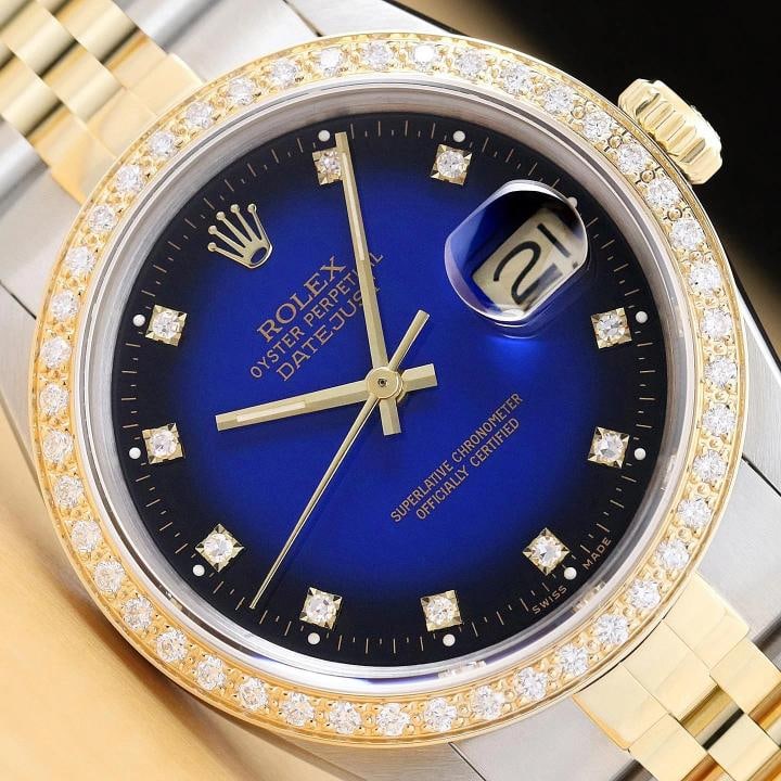 ROLEX DATEJUST 16233 BLUE VIGNETTE FACTORY DIAMOND 18K GOLD STEEL TWO TONE WATCH: This is an authentic Rolex Datejust 16233 watch with a two tone 18K yellow gold and stainless steel jubilee bracelet, factory Rolex diamond dial Ref., and custom 18K yellow gold diamond bezel. Descrip