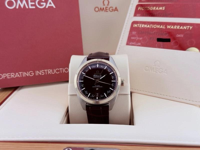 Omega Globemaster Annual Calendar 130.23.41.22.11.001 18K Sedna Gold Box Papers: Style Number: 130.23.41.22.11.001 Model: Omega Globemaster Annual Calendar Year: 2021 - 2026 Case Material: Stainless Steel Band: Leather Bezel: 18K Sedna Gold Dial: Burgundy Crystal: Sapphire Case