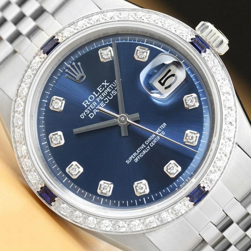 MENS ROLEX DATEJUST 18K WHITE GOLD SAPPHIRE DIAMOND & STAINLESS STEEL BLUE WATCH: Condition: Pre-owned - Excellent,Bezel Color: Silver,Max Wrist Size: 7.26-7.5 in,Number of Jewels: 26 Jewels,Indices: Diamond Hour Marks, 12-Hour Dial,Bezel: Custom 18K White Gold Sapphire Diamond Bez