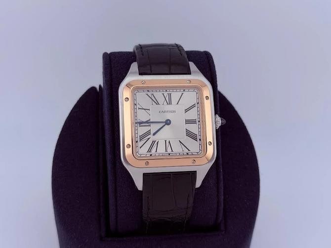 Cartier Santos Dumont XL W2SA0017 4305 33.9mm Silver Dial 18k Rose Gold Steel: Style Number: W2SA0017 / 4305 Serial: 4128**** Year: 2020-Present Model: Carter Santos Dumont XL Case Material: Stainless Steel Band: Black Leather Bezel: 18k Rose Gold Dial: Silver Roman Numeral